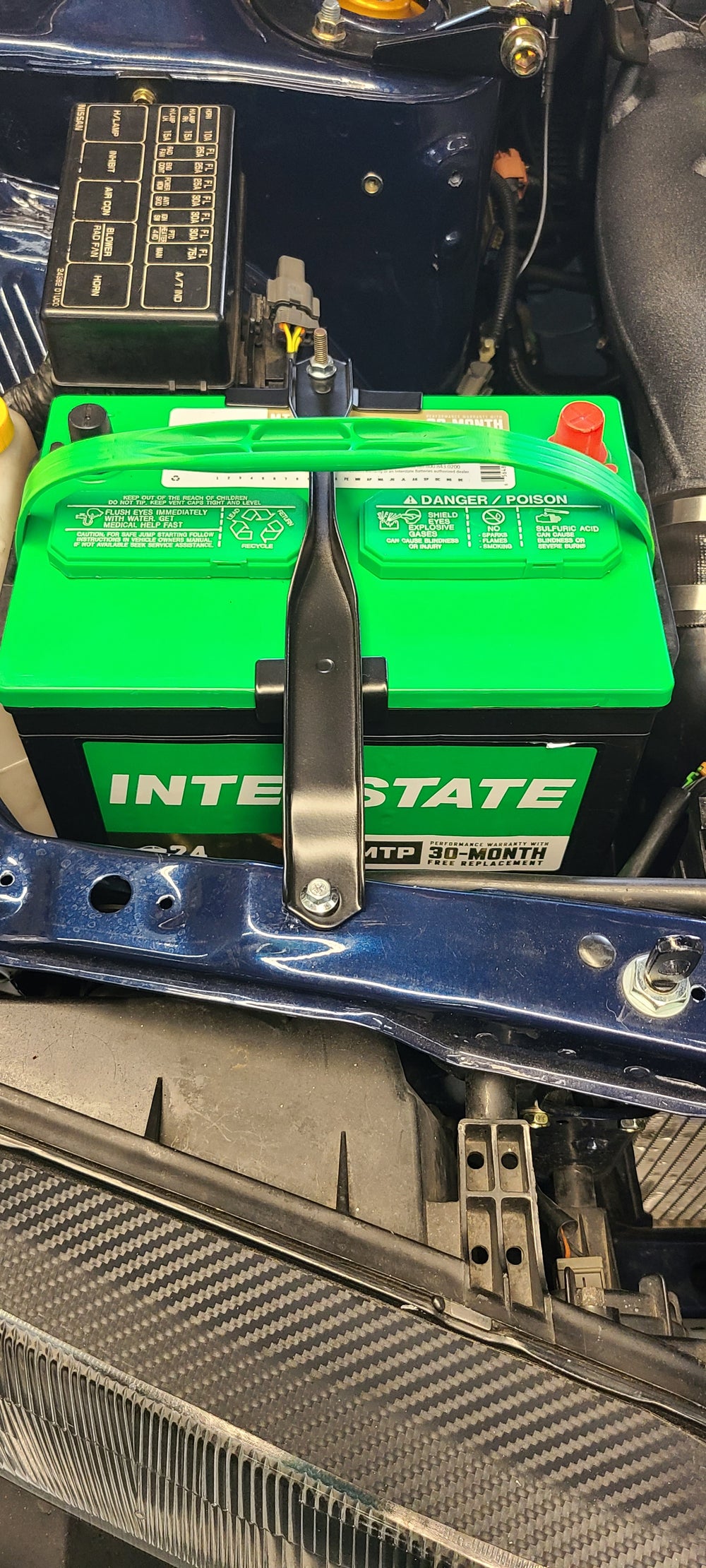 R32 battery hold down